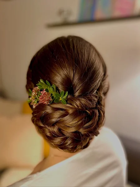 Glossy Brunette Braided Low Bun with Succulents