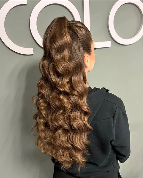 High Voluminous Wavy Ponytail with Sleek Lift