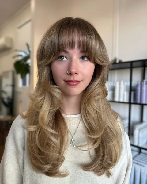 Honey-Blonde Butterfly Cut with Voluminous Fringe
