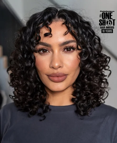 Honey-Bronzed Curly Afro with Soft Face-Framing Bangs