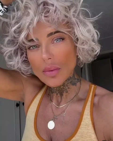 Icy Platinum Curly Bob with Wispy Bangs