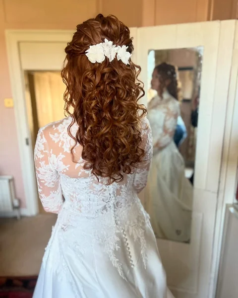 Intricate Curly Updo with Pearl Accents