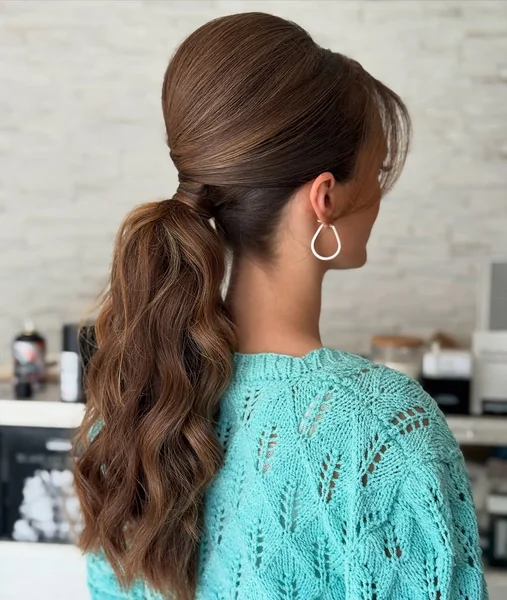 Low Voluminous Blonde Ponytail with Wrapped Base
