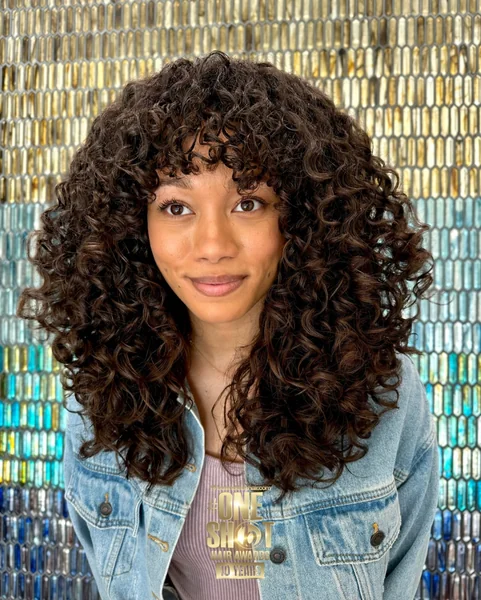 Luxe Brunette Curls with Voluminous Shag Layers