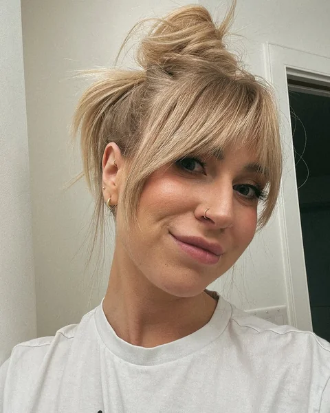 Messy Blonde Top Knot with Wispy Tapered Fringe