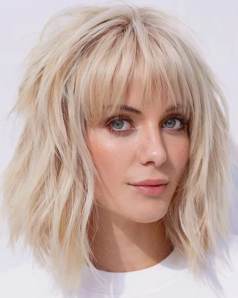 Messy Brunette Bob with Voluminous Face-Framing Waves