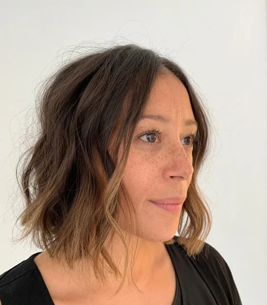 Messy Chocolate Bob with Soft Sun-Kissed Face-Framing Waves