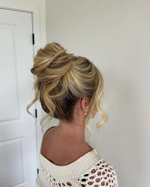 Messy Textured High Bun with Sun-Kissed Highlights