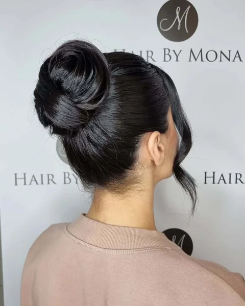 Minimalist Sleek High Bun with Side-Swept Bangs