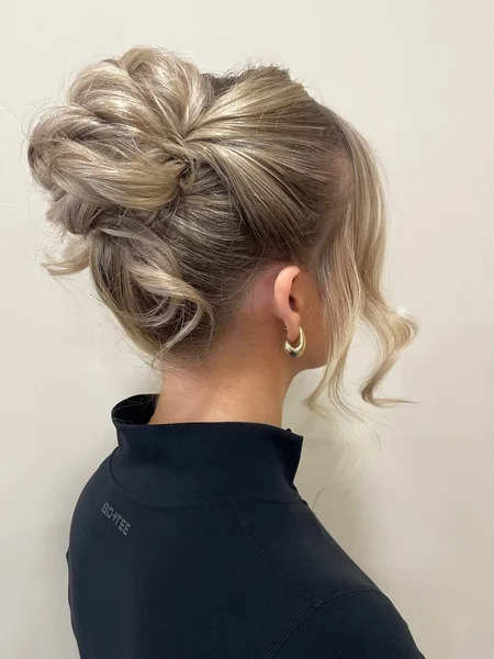 Modern High-Volume Ash Blonde Ponytail with Face-Framing Tendrils