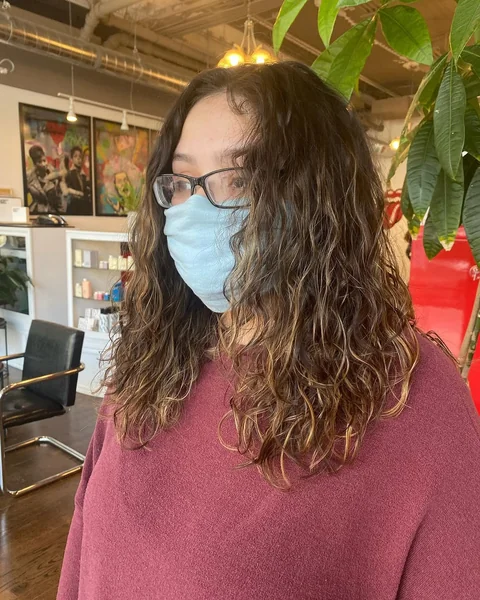 Natural Medium Wavy Cut with Sun-Kissed Dimensions
