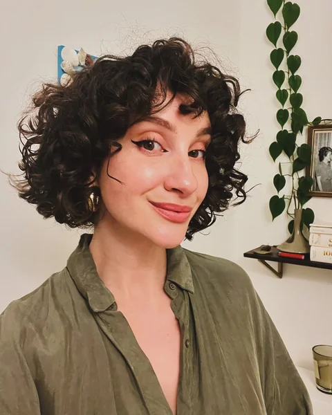 Playful Dark Curly Bob with Short Soft Fringe