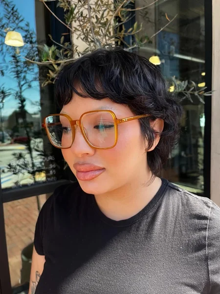 Polished Ebony Pixie with Sleek Finger-Wave Texture