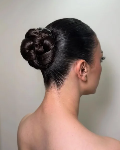 Polished Midnight Chignon with Intricate Braided Texture