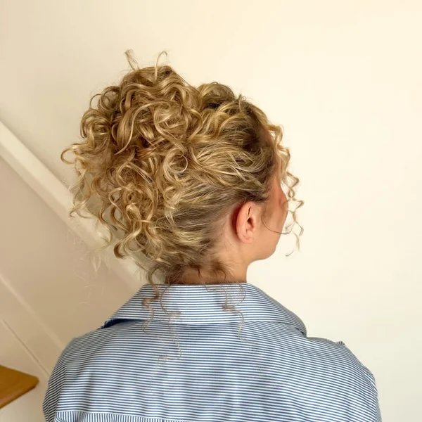 Radiant Golden Bronze Afro with Soft Defined Bangs