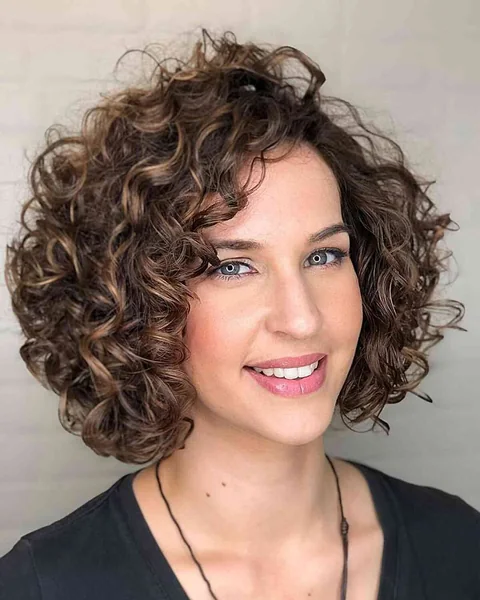 Radiant Honey-Bronze Afro with Soft Face-Framing Bangs