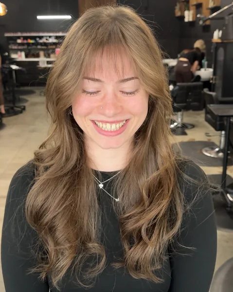 Radiant Icy Blonde Layers with Full Statement Bangs