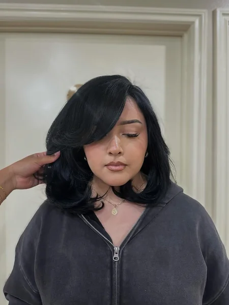 Retro-Inspired Inward Curved Bob with Dramatic Side Sweep