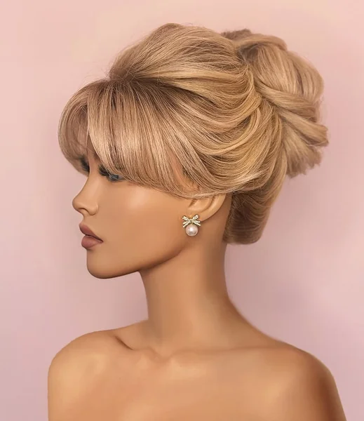 Retro Glam Honey Blonde Chignon with Swept Bangs