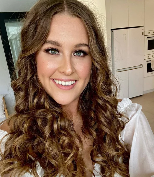Romantic Half-Up Copper Curls with Floral Vine