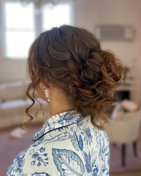 Romantic Loose Curly Updo with Face-Framing Tendrils