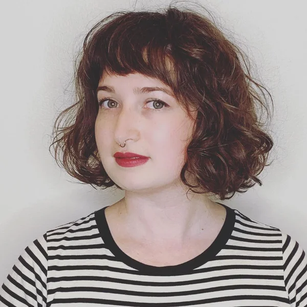 Romantic Wavy Bob with Full, Sweeping Fringe