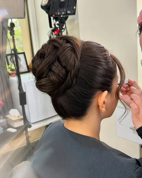 Sculpted Rose-Style High Bun for Brunettes