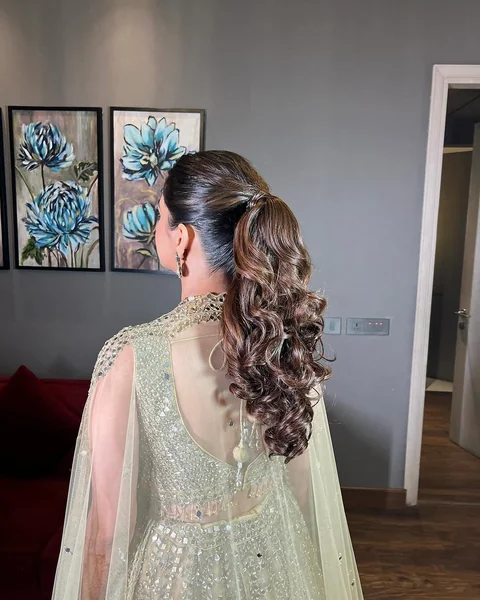 Sky-High Messy Ponytail with Beachy Curls