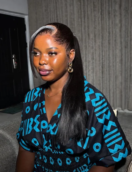 Sleek Black Ponytail with Bold Silver Frontal Streak