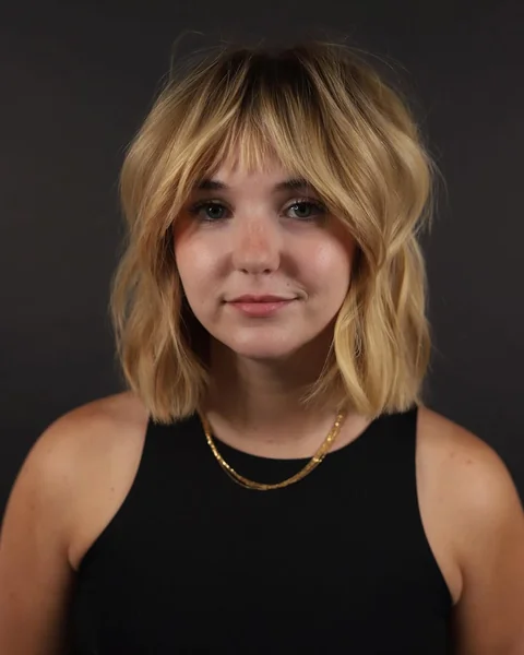Sleek Honey Blonde Layers with Face-Framing Choppy Ends