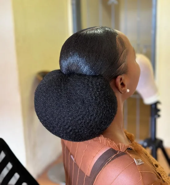 Sleek Low Braided Bun for Elegant Occasions