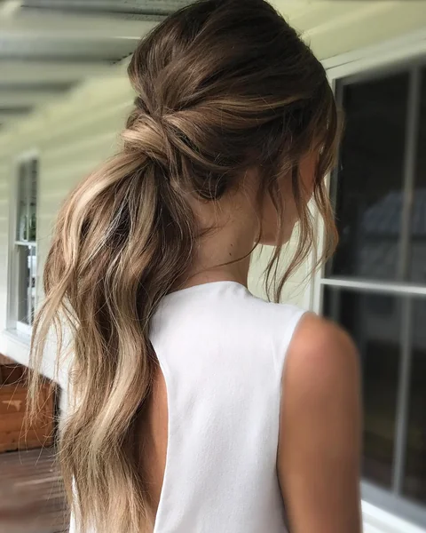 Sleek Side-Parted Ponytail with Sculpted Edges
