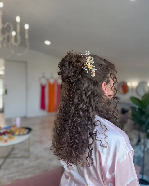 Sleek Top Knot with Defined Spiral Tendrils
