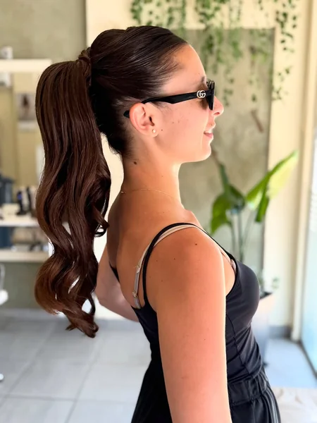 Smooth, Polished High Ponytail with Classic Curls