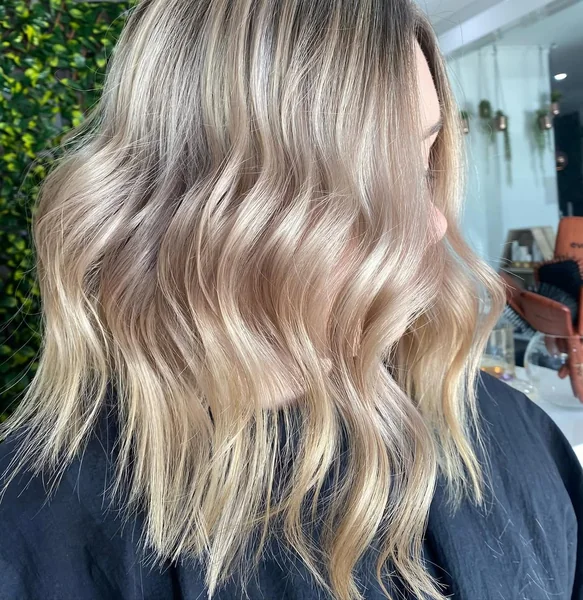 Soft Icy Blonde Lob with Beachy Interior Waves