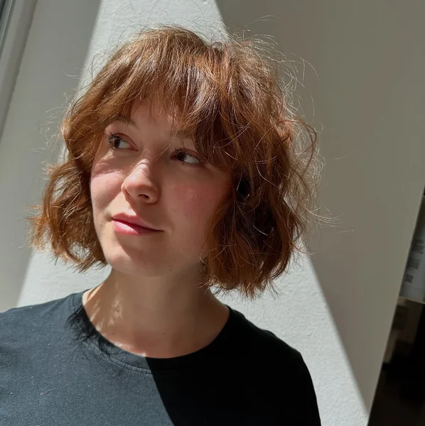 Soft Auburn Shaggy Bob with Wispy Bangs