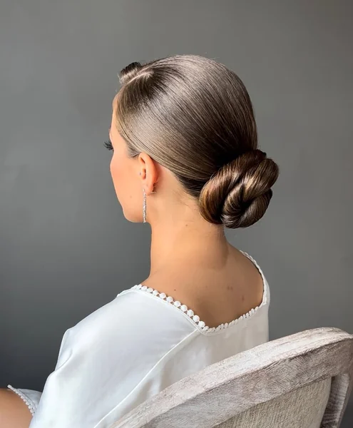 Sophisticated Low Sculpted Bun for Glossy Medium Hair