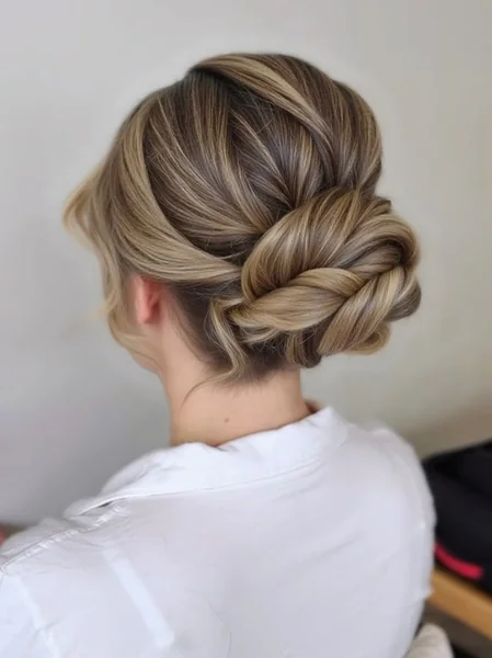 Structured Low Knot with Woven Blonde Highlights