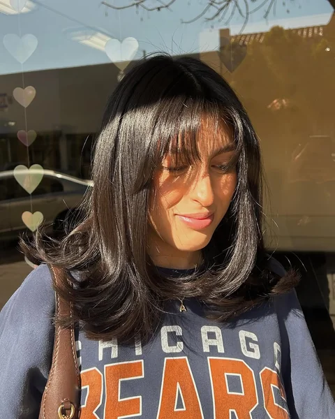 Sun-Kissed Brunette Layers with Airy Face-Framing Taper