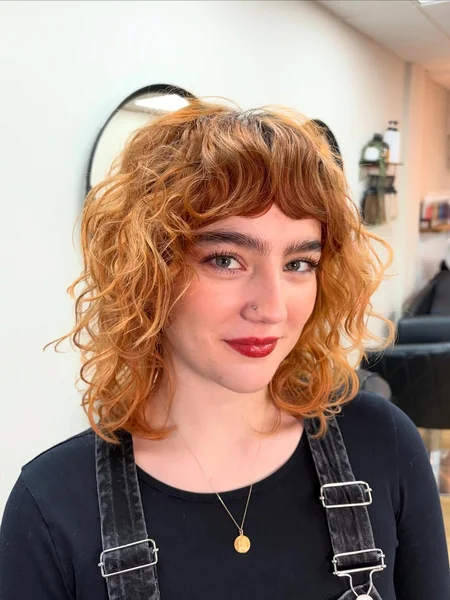 Sunset Ginger Curls with Retro Arched Bangs