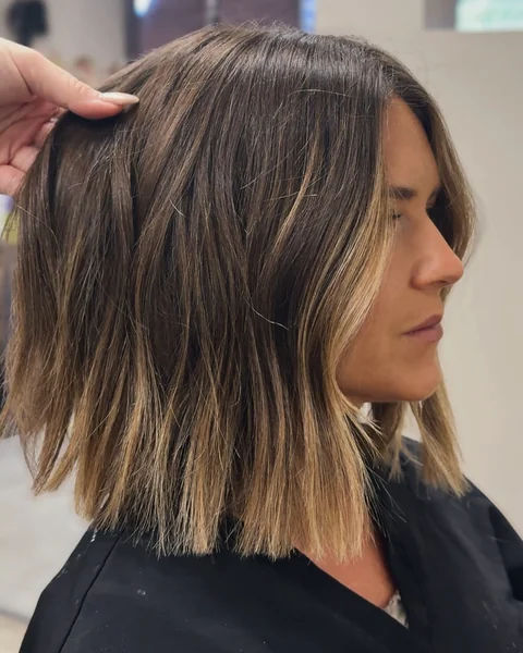 Textured Brunette Lob with Sun-Kissed Highlights