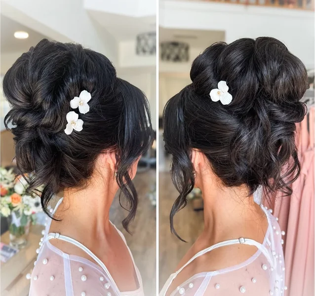 Textured Ebony High Bun with Floral Accents