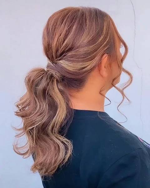 Textured Low Ponytail Wrapped with Soft Waves