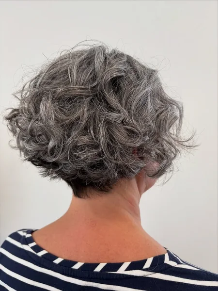 Textured Silver Curly Bob with Tapered Nape