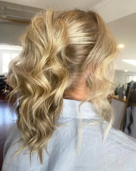 Tousled Platinum Blonde Messy Low Ponytail