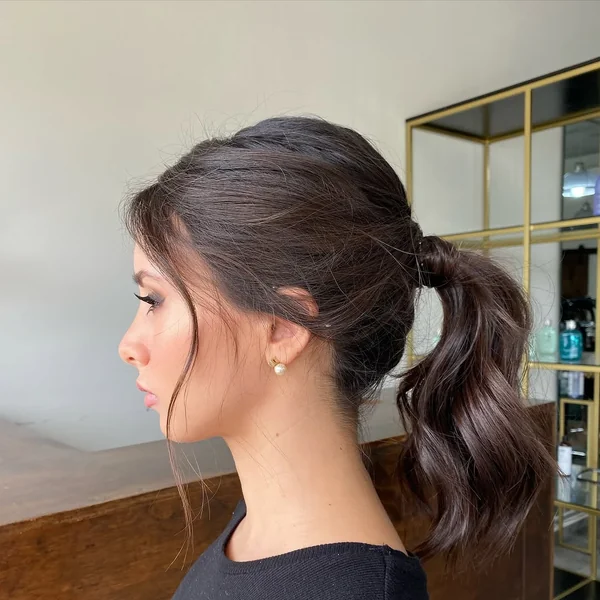 Undone Wavy Brunette Low Messy Ponytail