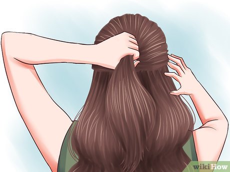 Step 1 Gather two sections the top of your hair to pull back.