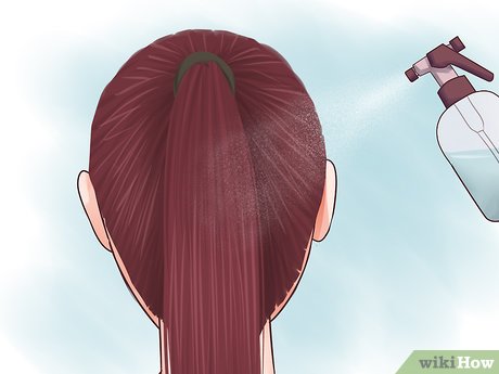 Step 2 Spray your hair with water.