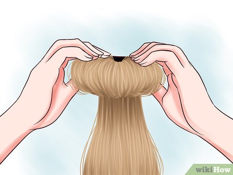 Step 3 Pull your hair up into a high ponytail and secure it with an elastic.