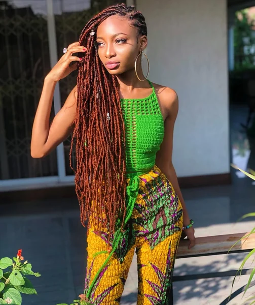 Vibrant Copper Faux Locs with Side-Swept Volume